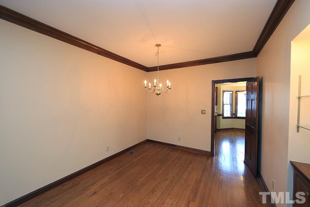 122 Skylark Way Raleigh, NC 27615 - Photo 15 of 30 wooden floor in an empty room with a window