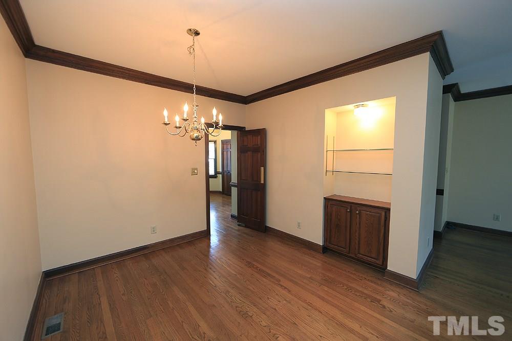 122 Skylark Way Raleigh, NC 27615 - Photo 16 of 30 a view of a storage & utility room with closet wooden floor and windows