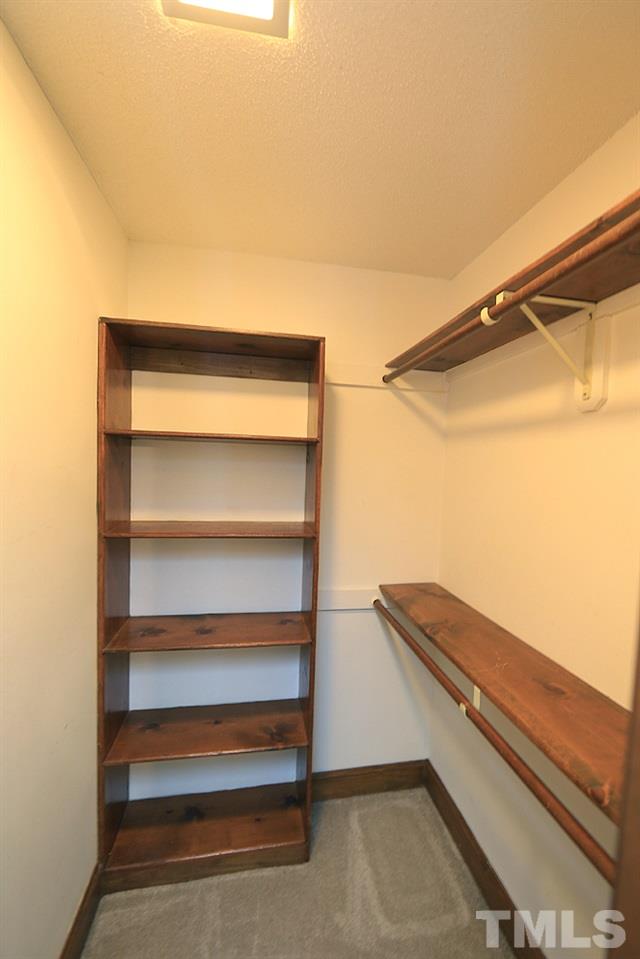 122 Skylark Way Raleigh, NC 27615 - Photo 25 of 30 a view of walk in closet with empty racks