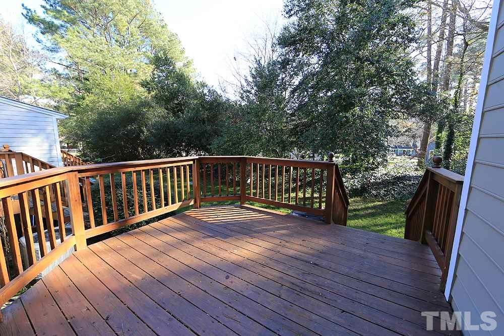 122 Skylark Way Raleigh, NC 27615 - Photo 27 of 30 a view of deck with wooden floor and outdoor seating