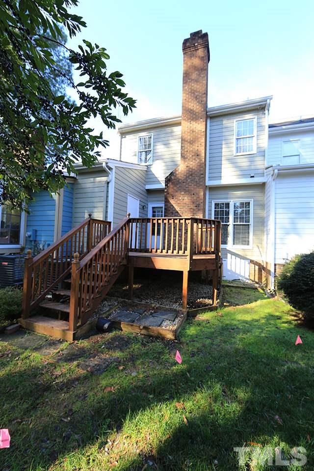 122 Skylark Way Raleigh, NC 27615 - Photo 30 of 30 a view of a deck with a yard chairs and a small yard
