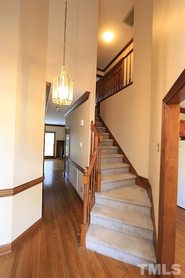 122 Skylark Way Raleigh, NC 27615 - Photo 5 of 30 a view of entryway and hall with wooden floor