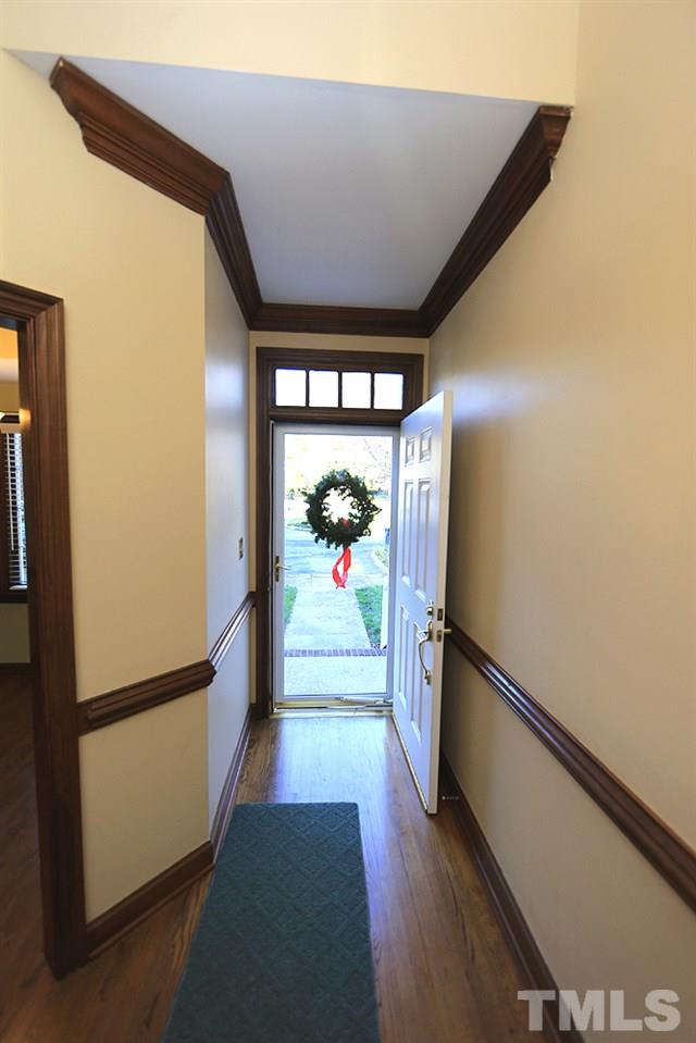 122 Skylark Way Raleigh, NC 27615 - Photo 6 of 30 a view of a hallway with wooden floor and furniture