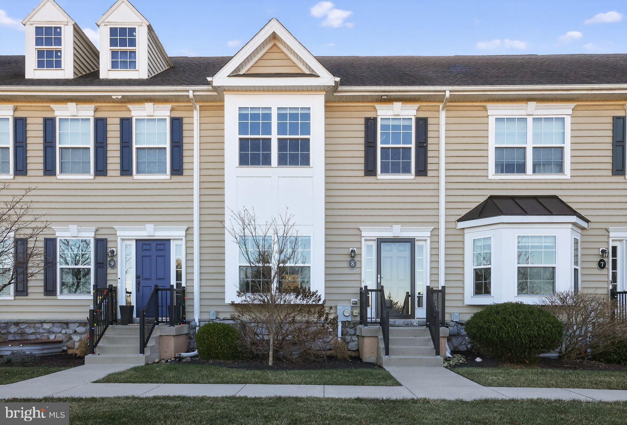 3669 Jacob Stout Road, Unit 8 Doylestown, PA 18902 - Photo 1 of 34 a front view of a house with a yard