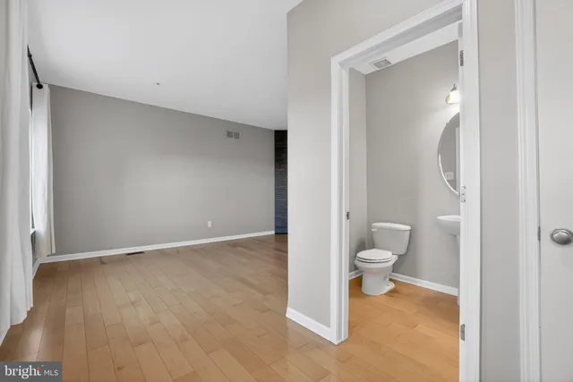 a bathroom with a toilet and a vanity