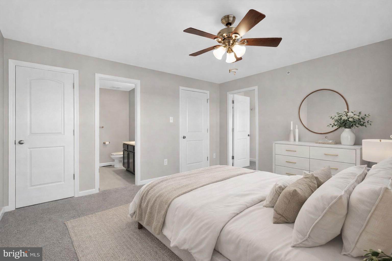 3669 Jacob Stout Road, Unit 8 Doylestown, PA 18902 - Photo 14 of 34 a bedroom with a large bed and a chandelier