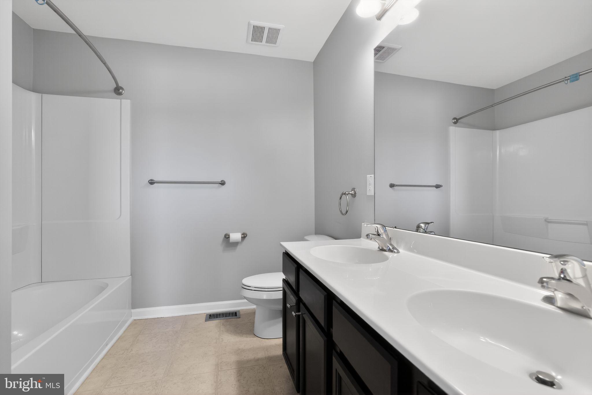 3669 Jacob Stout Road, Unit 8 Doylestown, PA 18902 - Photo 18 of 34 a bathroom with a sink a toilet and shower