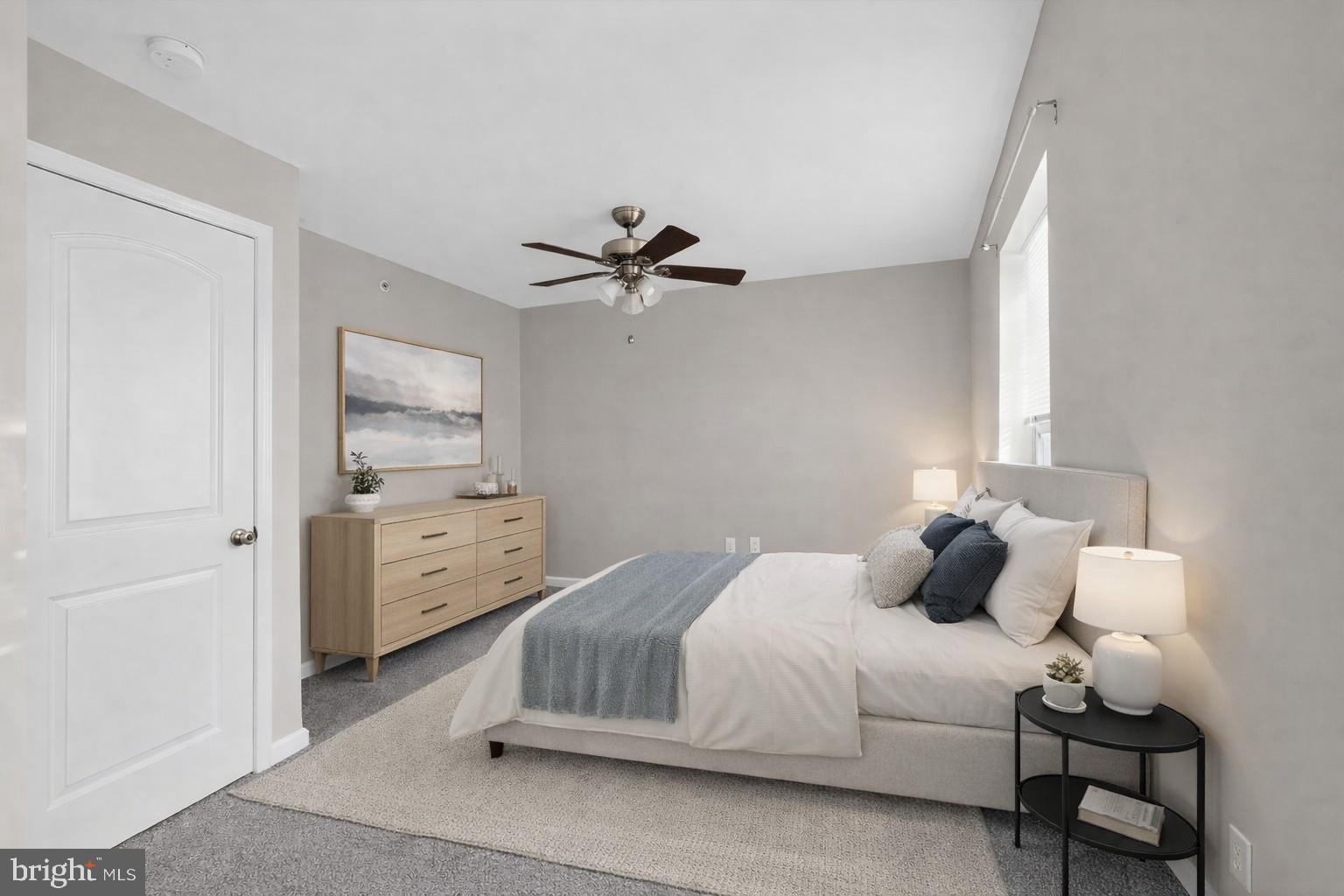 3669 Jacob Stout Road, Unit 8 Doylestown, PA 18902 - Photo 20 of 34 a bedroom with a bed and a chandelier