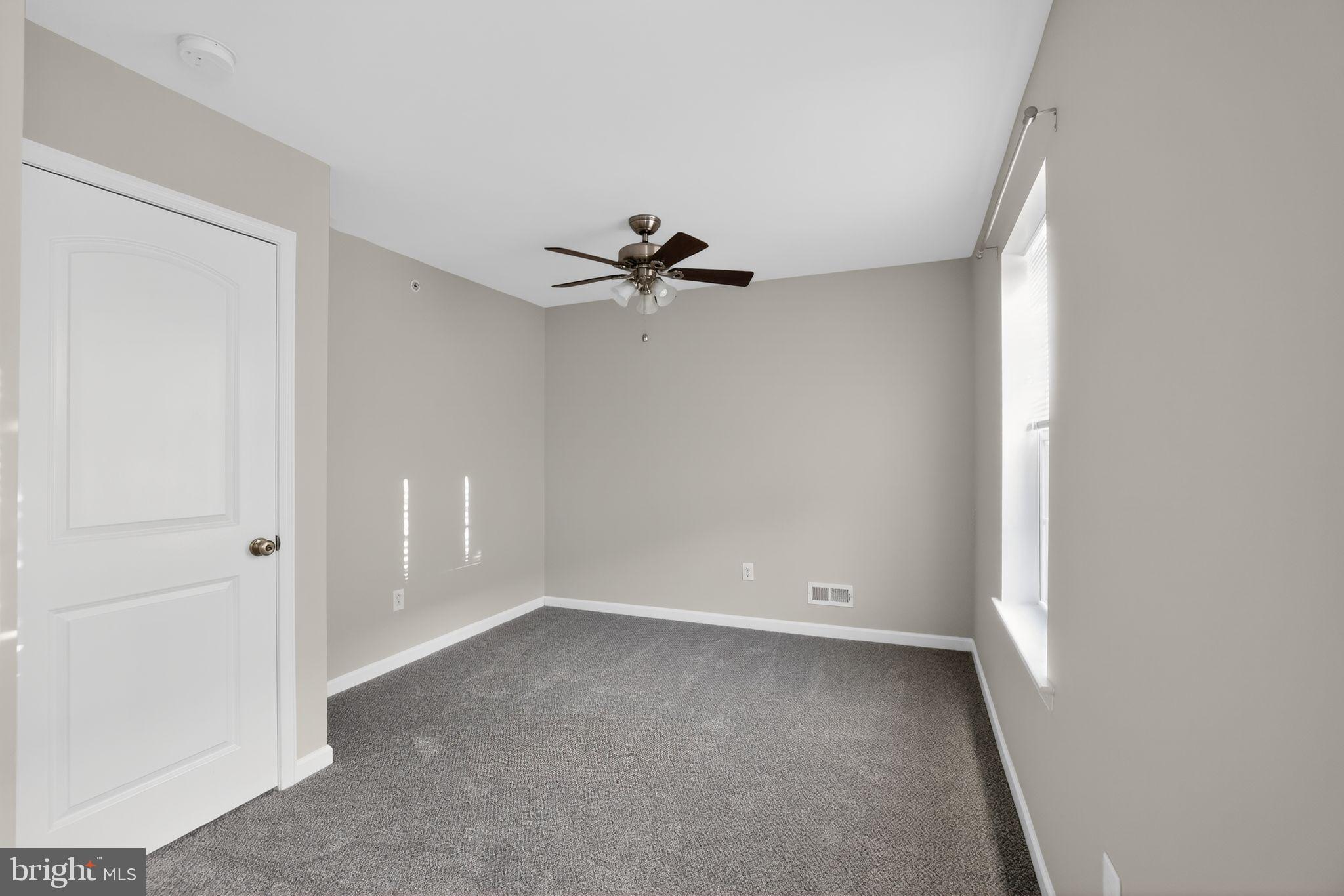 3669 Jacob Stout Road, Unit 8 Doylestown, PA 18902 - Photo 21 of 34 wooden floor in an empty room with a window