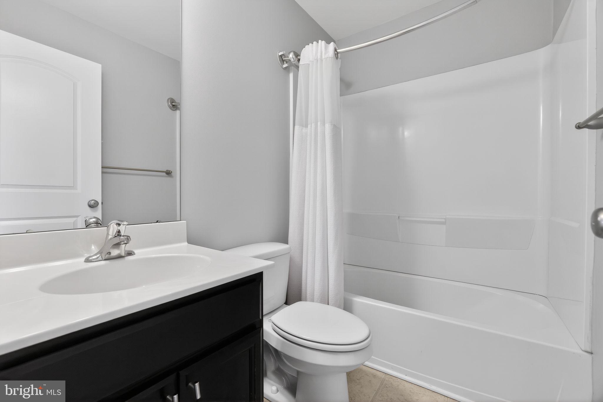 3669 Jacob Stout Road, Unit 8 Doylestown, PA 18902 - Photo 22 of 34 a bathroom with a sink a toilet and shower