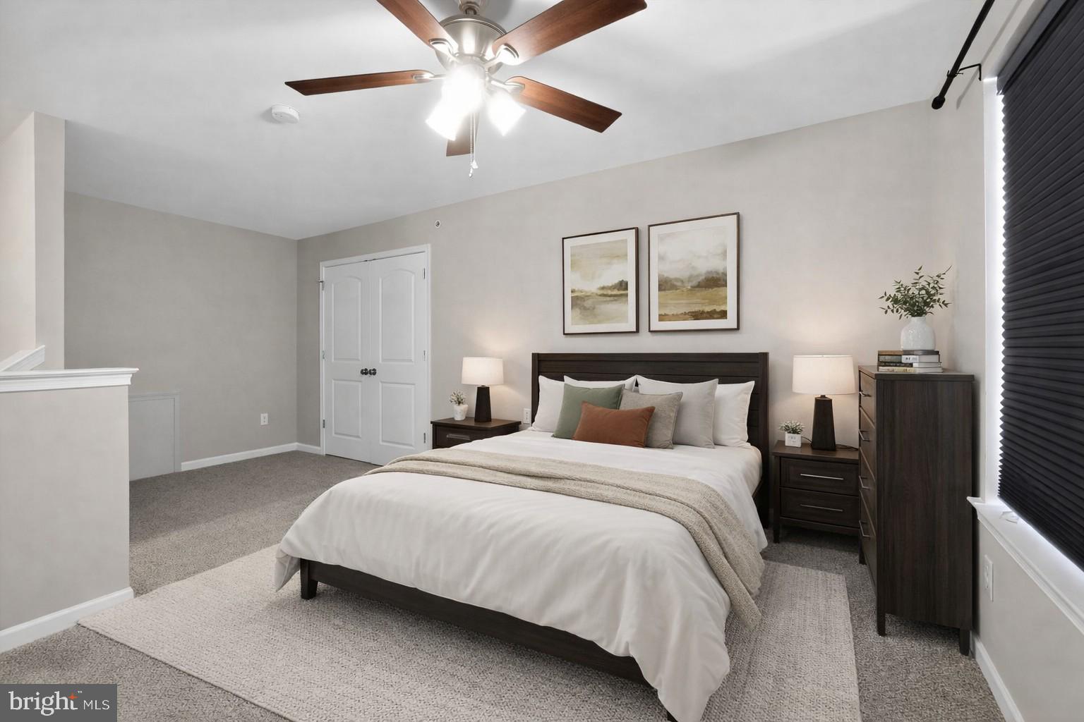 3669 Jacob Stout Road, Unit 8 Doylestown, PA 18902 - Photo 25 of 34 a bedroom with a large bed and a chandelier