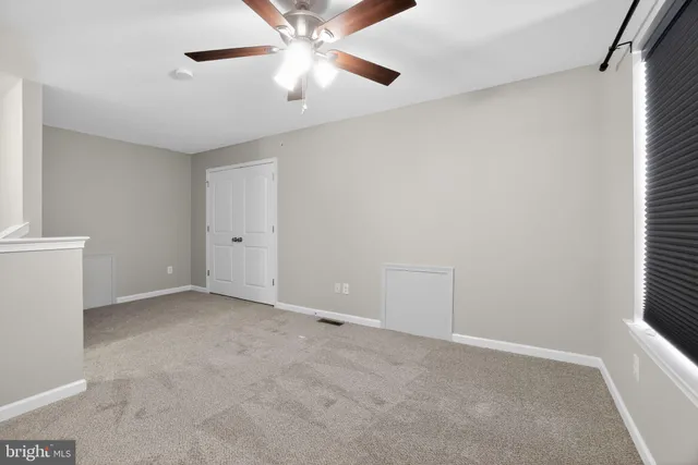 a view of a house with a yard and stairs