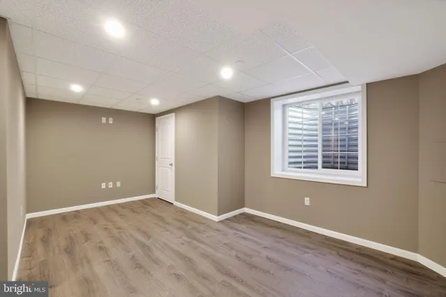 a view of a patio with a table and chairs and ice snow