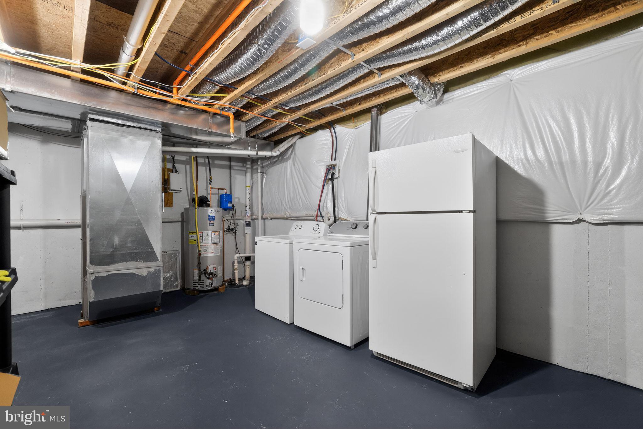 3669 Jacob Stout Road, Unit 8 Doylestown, PA 18902 - Photo 30 of 34 a utility room with dryer and washer