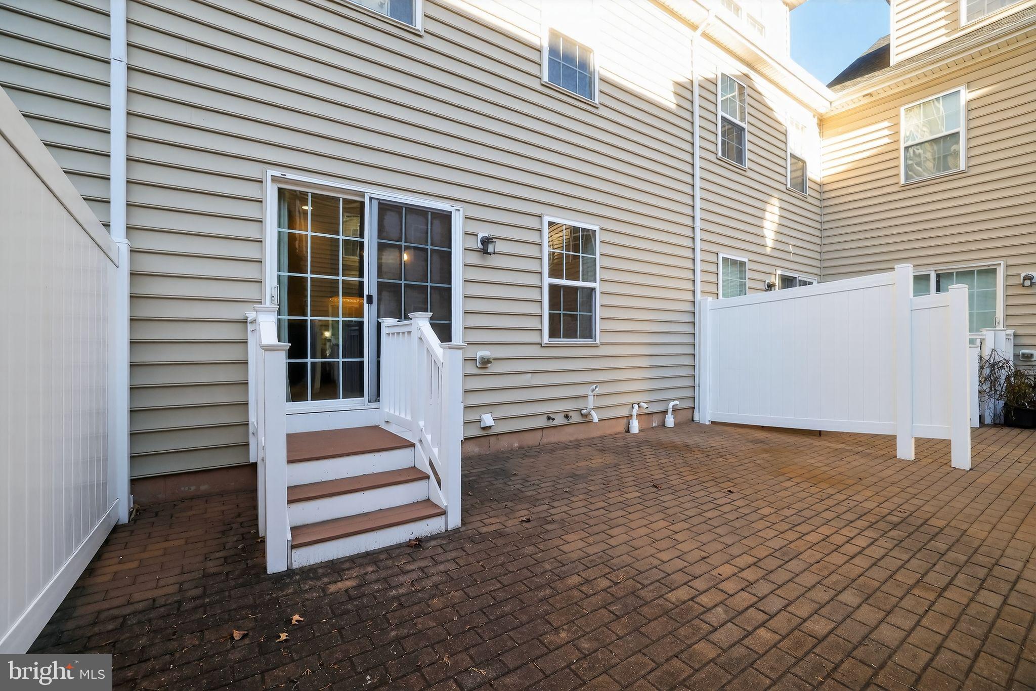 3669 Jacob Stout Road, Unit 8 Doylestown, PA 18902 - Photo 31 of 34 a view of a house with a yard and stairs