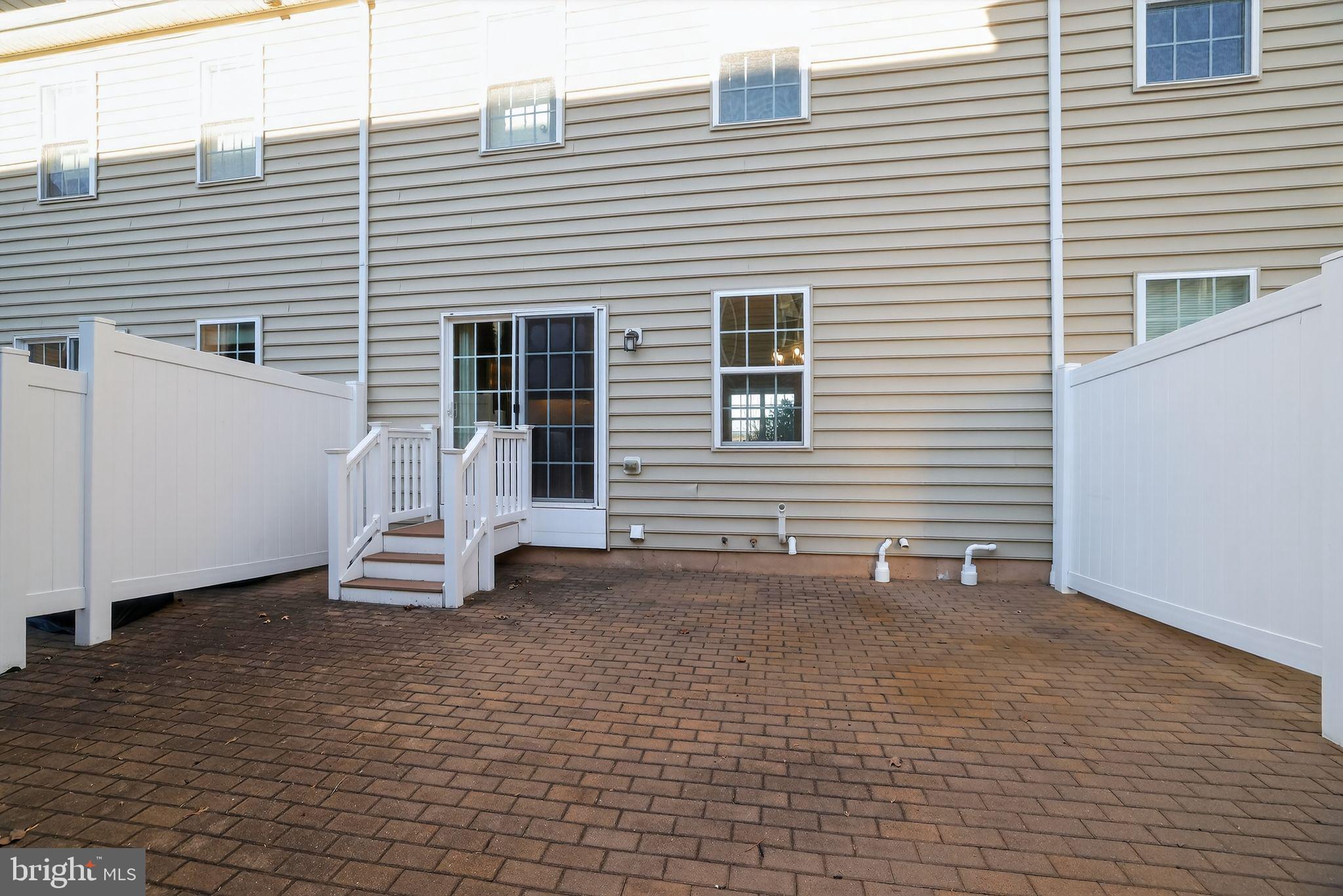 3669 Jacob Stout Road, Unit 8 Doylestown, PA 18902 - Photo 33 of 34 a view of a house with a patio