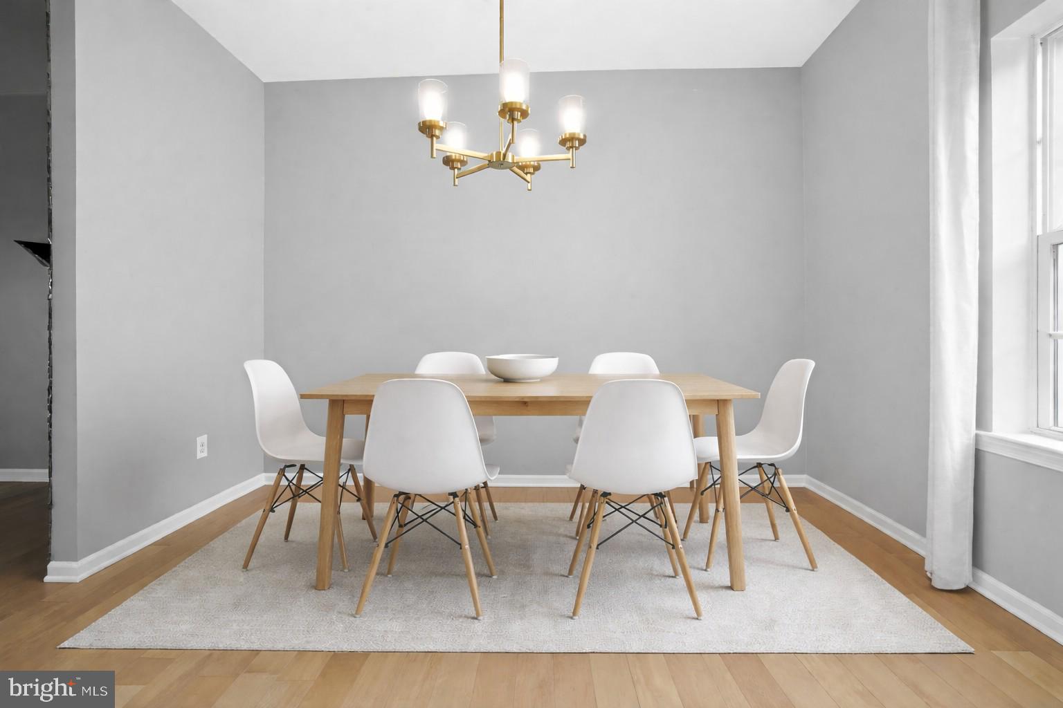 3669 Jacob Stout Road, Unit 8 Doylestown, PA 18902 - Photo 8 of 34 a view of a dining room with furniture and wooden floor