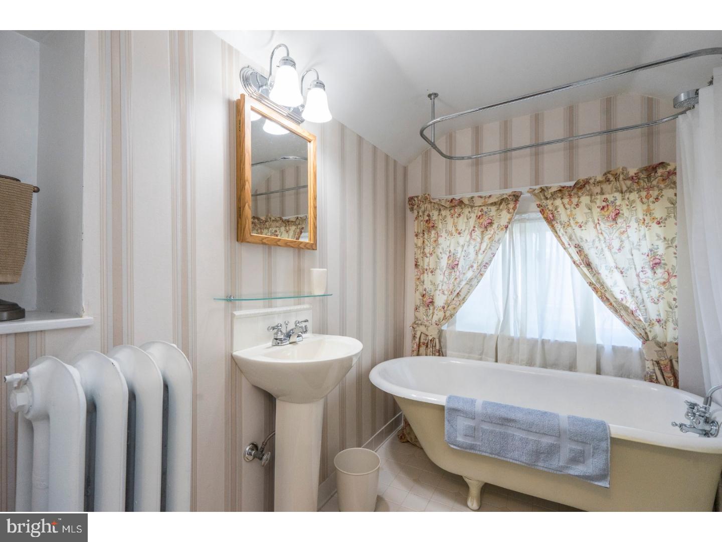 417 Netherwood Road Upper Darby, PA 19082 - Photo 22 of 24 a bathroom with a sink a toilet and a mirror