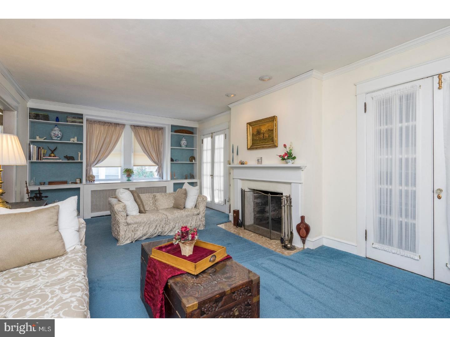 417 Netherwood Road Upper Darby, PA 19082 - Photo 4 of 24 a living room with furniture and a fireplace