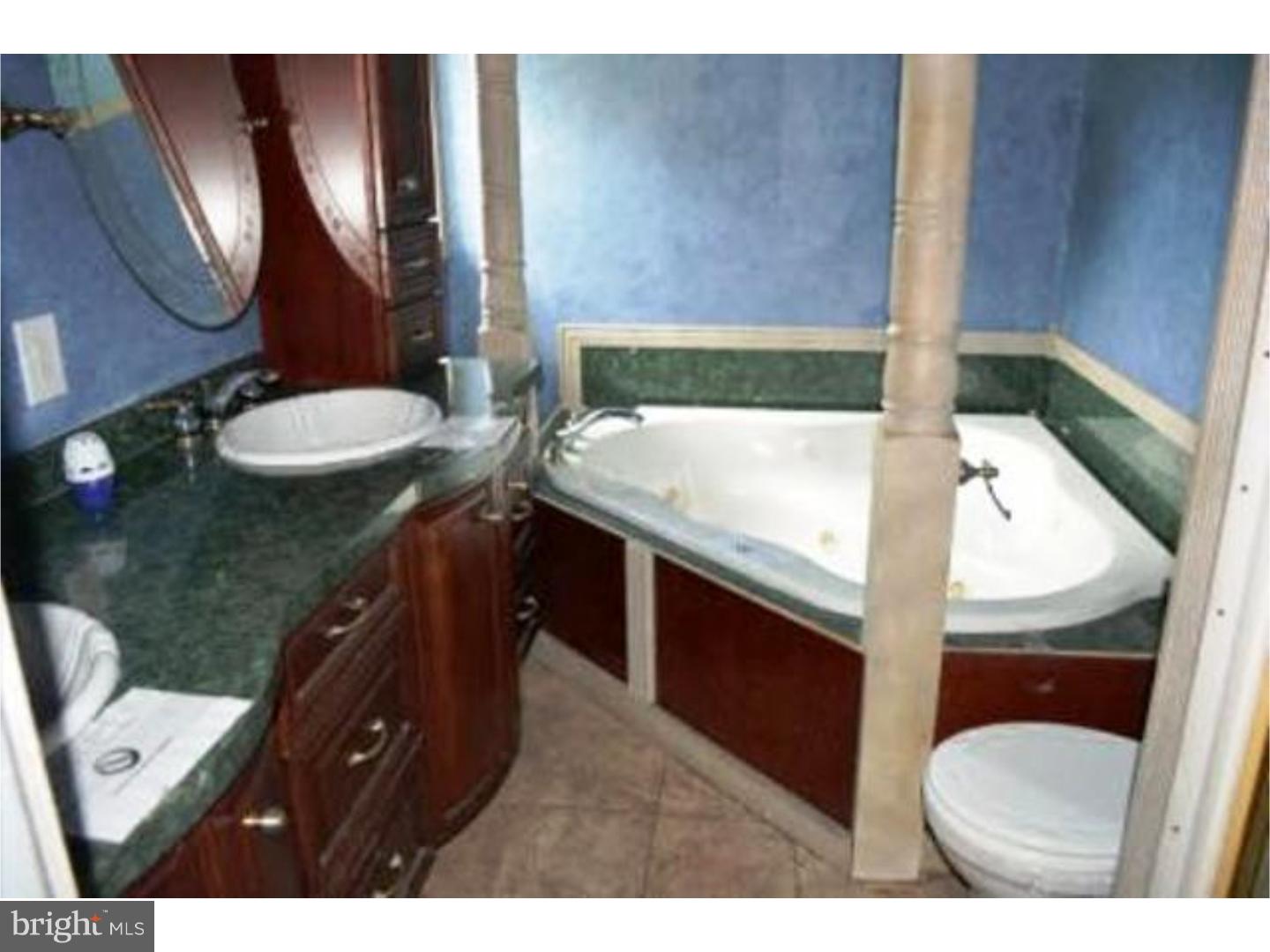 262 West Ridge Road Nottingham, PA 19362 - Photo 3 of 9 a bathroom with a toilet sink and mirror