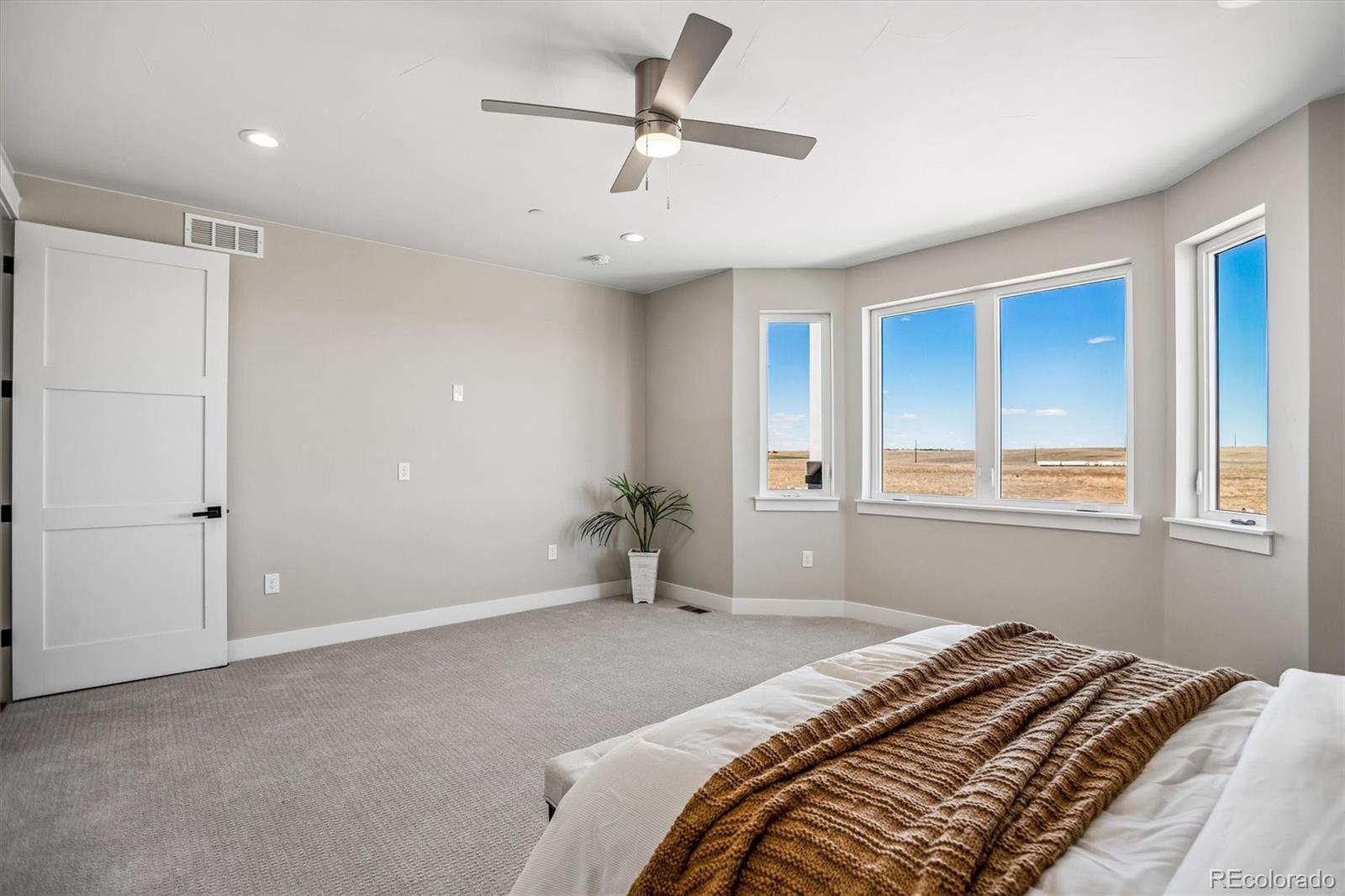 13350 Imboden Road Hudson, CO 80642 - Photo 18 of 50 a bedroom with a bed and a window