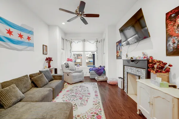 a living room with furniture and a flat screen tv