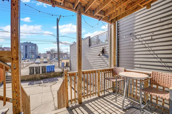 a picture of a bench in front of a building