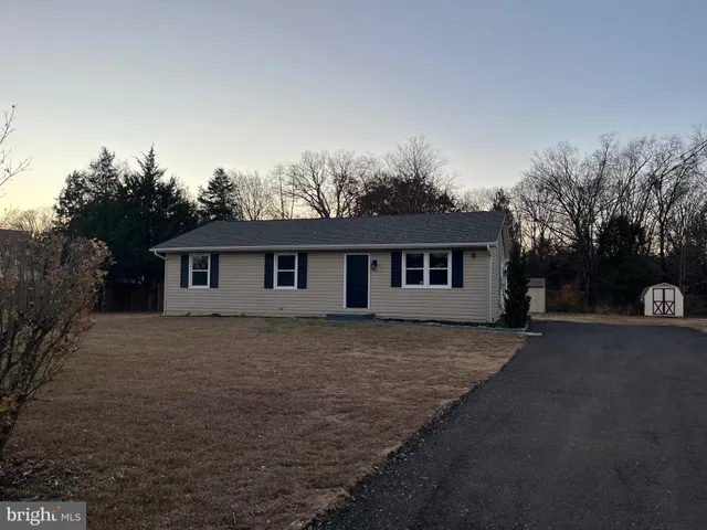 a house that has tree in front of it