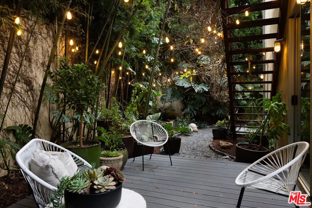 3103 Hamilton Way Los Angeles, CA 90026 - Photo 11 of 36 a view of a patio with couches a table and chairs and potted plants
