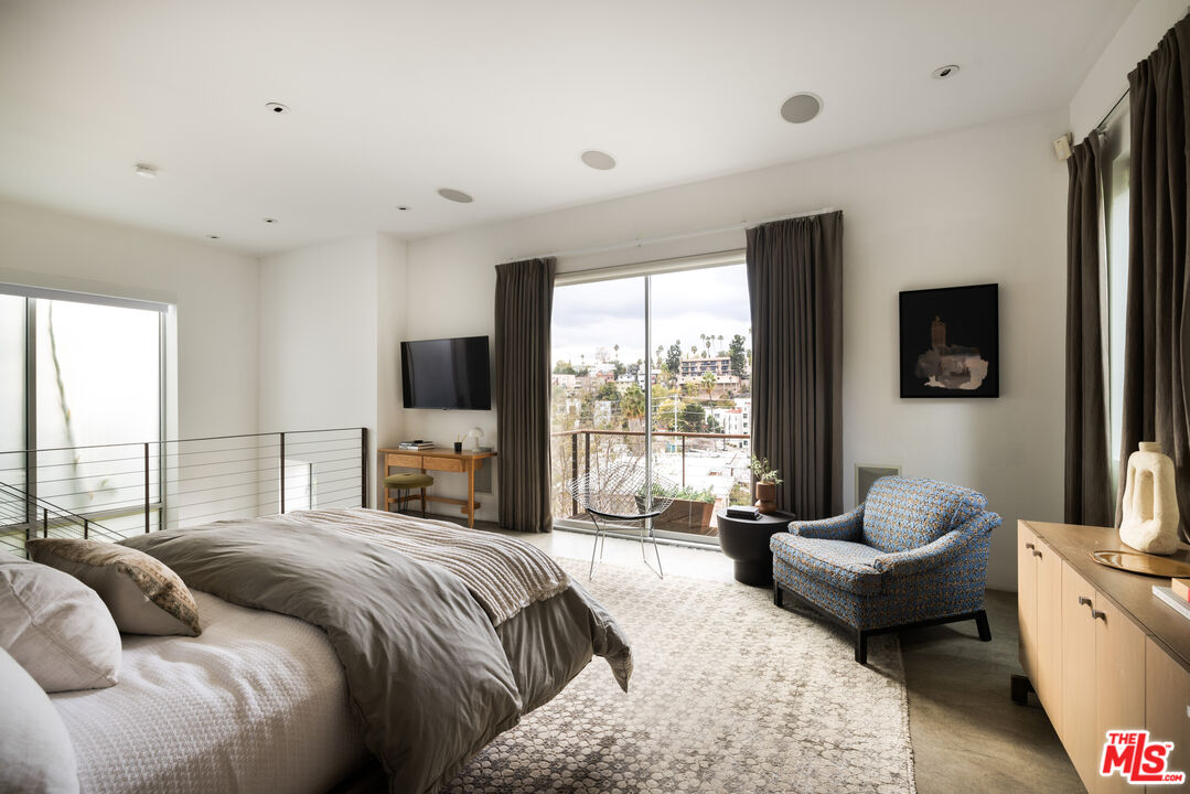 3103 Hamilton Way Los Angeles, CA 90026 - Photo 16 of 36 a bedroom with a bed and large windows