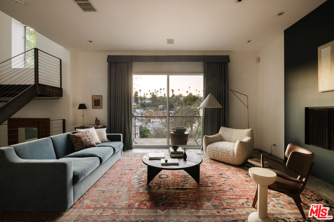 3103 Hamilton Way Los Angeles, CA 90026 - Photo 3 of 36 a living room with furniture fireplace and a flat screen tv