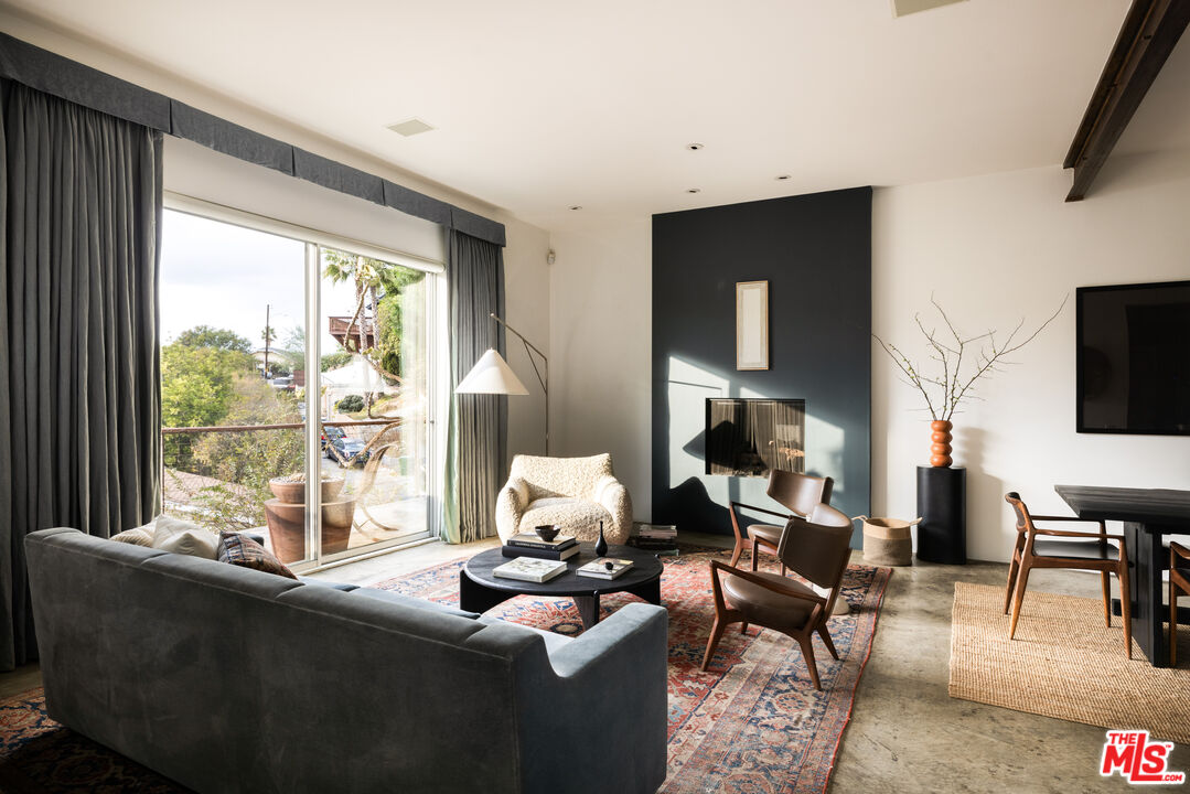 3103 Hamilton Way Los Angeles, CA 90026 - Photo 6 of 36 a living room with furniture and a floor to ceiling window