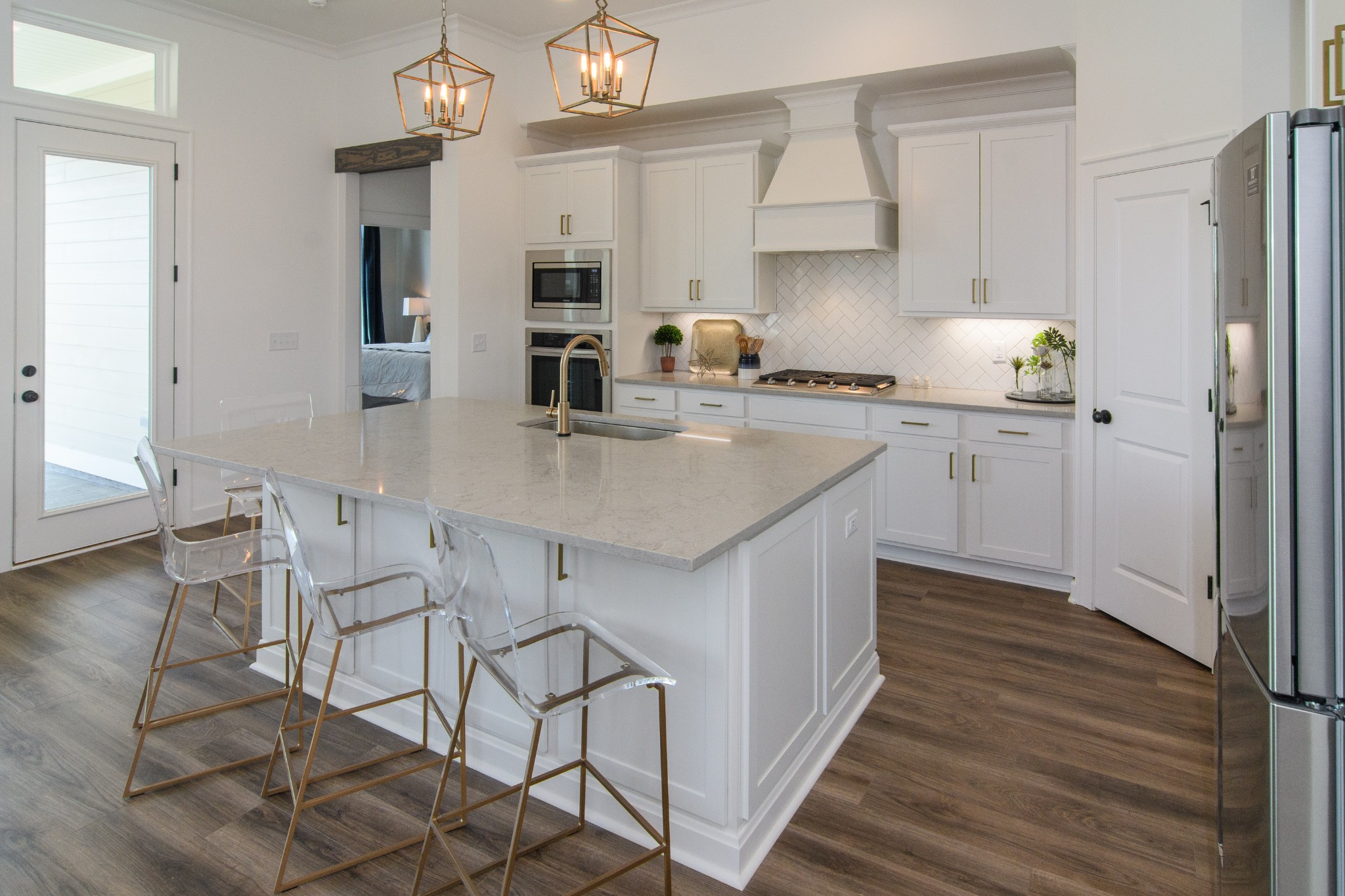 892 Plowson Road Mount Juliet, TN 37122 - Photo 14 of 39 a kitchen with stainless steel appliances granite countertop a sink dishwasher a stove refrigerator and cabinets with wooden floor