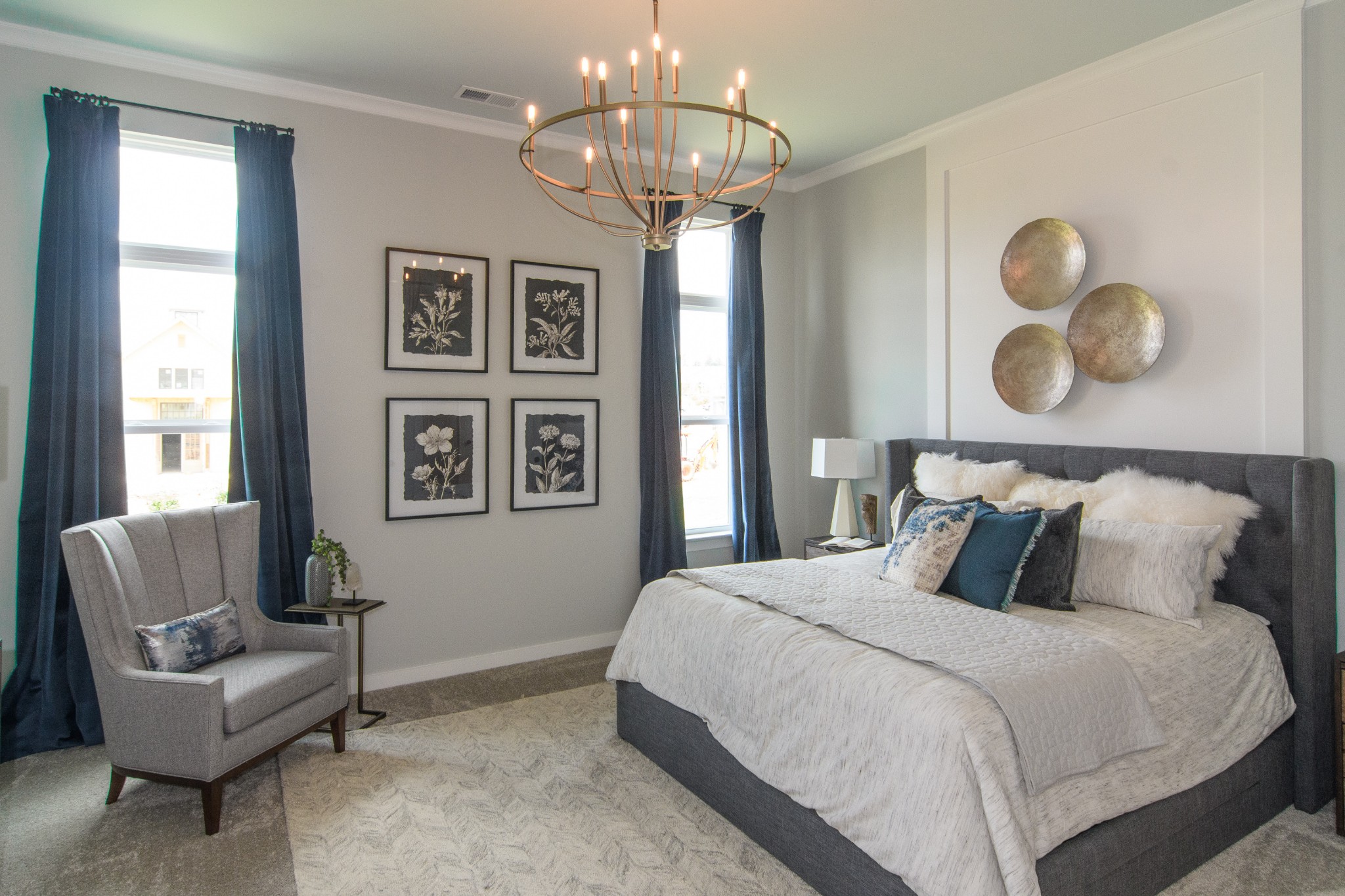 892 Plowson Road Mount Juliet, TN 37122 - Photo 17 of 39 a bedroom with a large bed and a couch