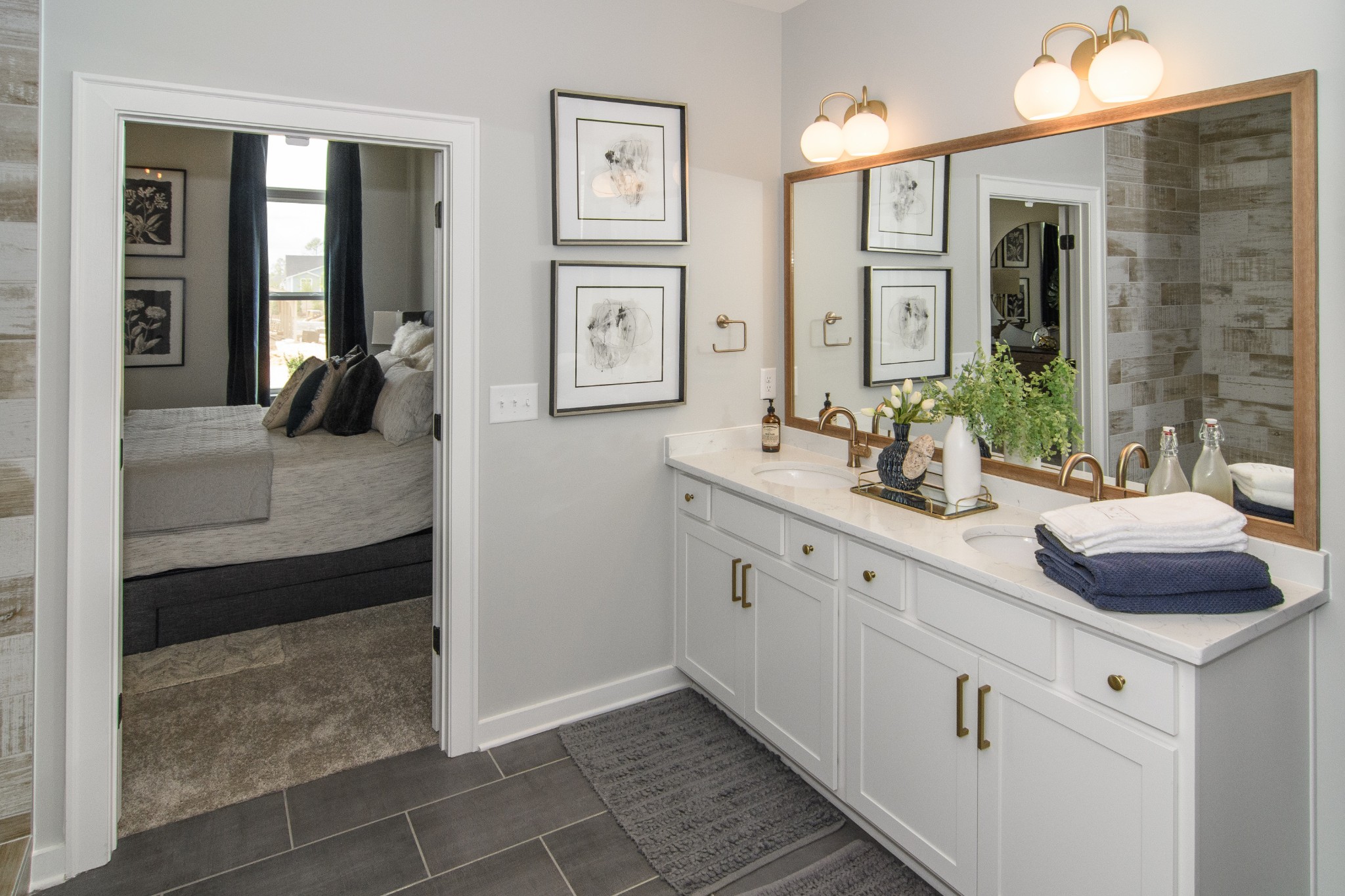 892 Plowson Road Mount Juliet, TN 37122 - Photo 18 of 39 a bathroom with a double vanity sink a mirror and a shower