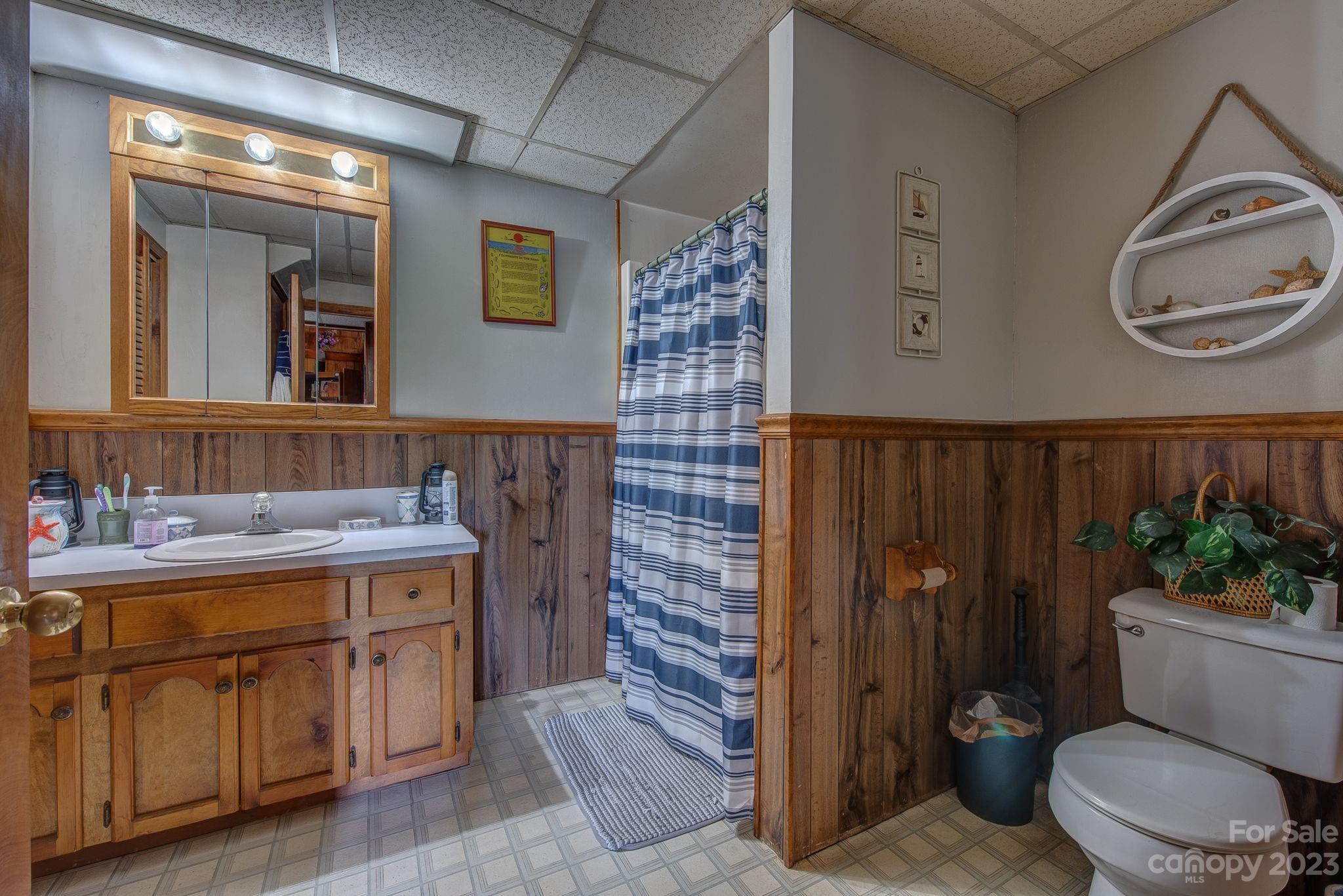 539 Kiser Road Bessemer City, NC 28016 - Photo 8 of 41 a bathroom with a toilet a sink and mirror
