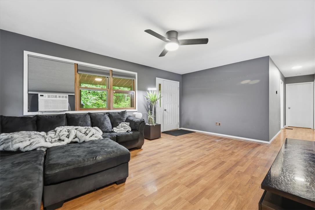 520 Highland Hill Road Jim Thorpe, PA 18235 - Photo 6 of 83 Hardwood floors and generous windows illuminate this inviting living area.