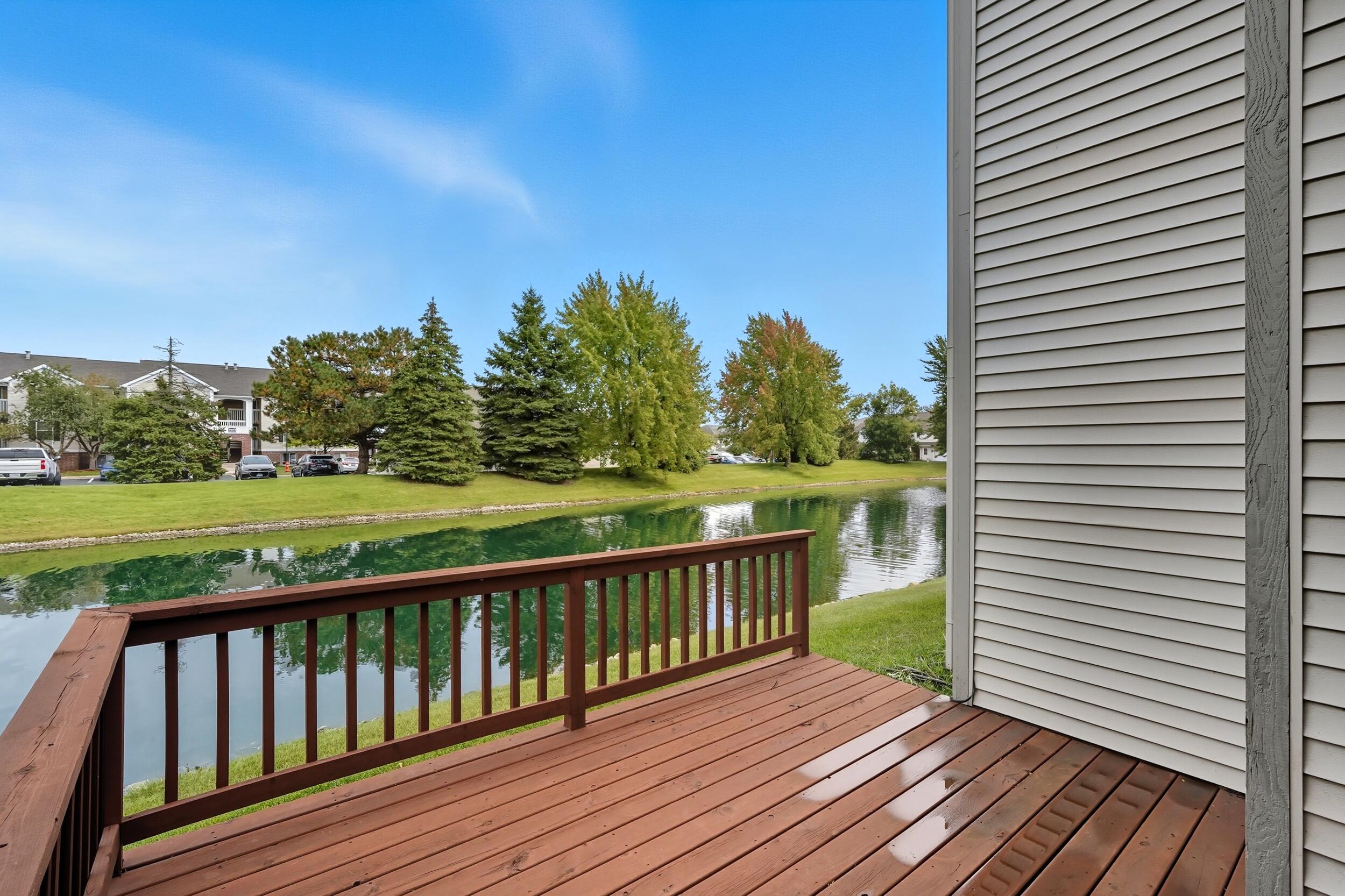9465 Van Buren Court Crown Point, IN 46307 - Photo 14 of 16 a view of deck with wooden floor and fence next to a yard