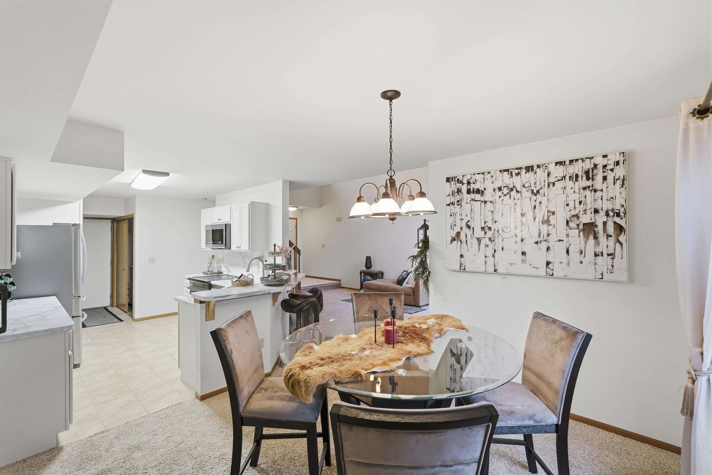 9465 Van Buren Court Crown Point, IN 46307 - Photo 7 of 16 a view of a dining room and a table or chairs