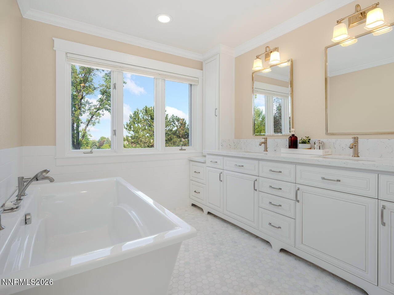1965 Palmira Drive Reno, NV 89511 - Photo 19 of 63 a bathroom with a bathtub a sink and a window
