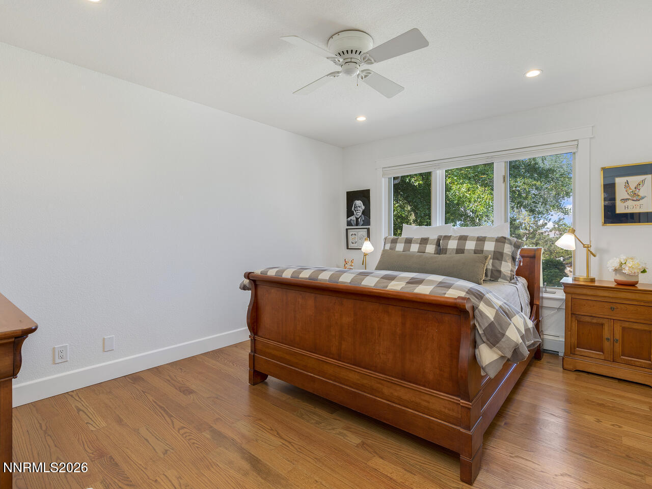 1965 Palmira Drive Reno, NV 89511 - Photo 22 of 63 a bed sitting in a spacious bedroom next to a window