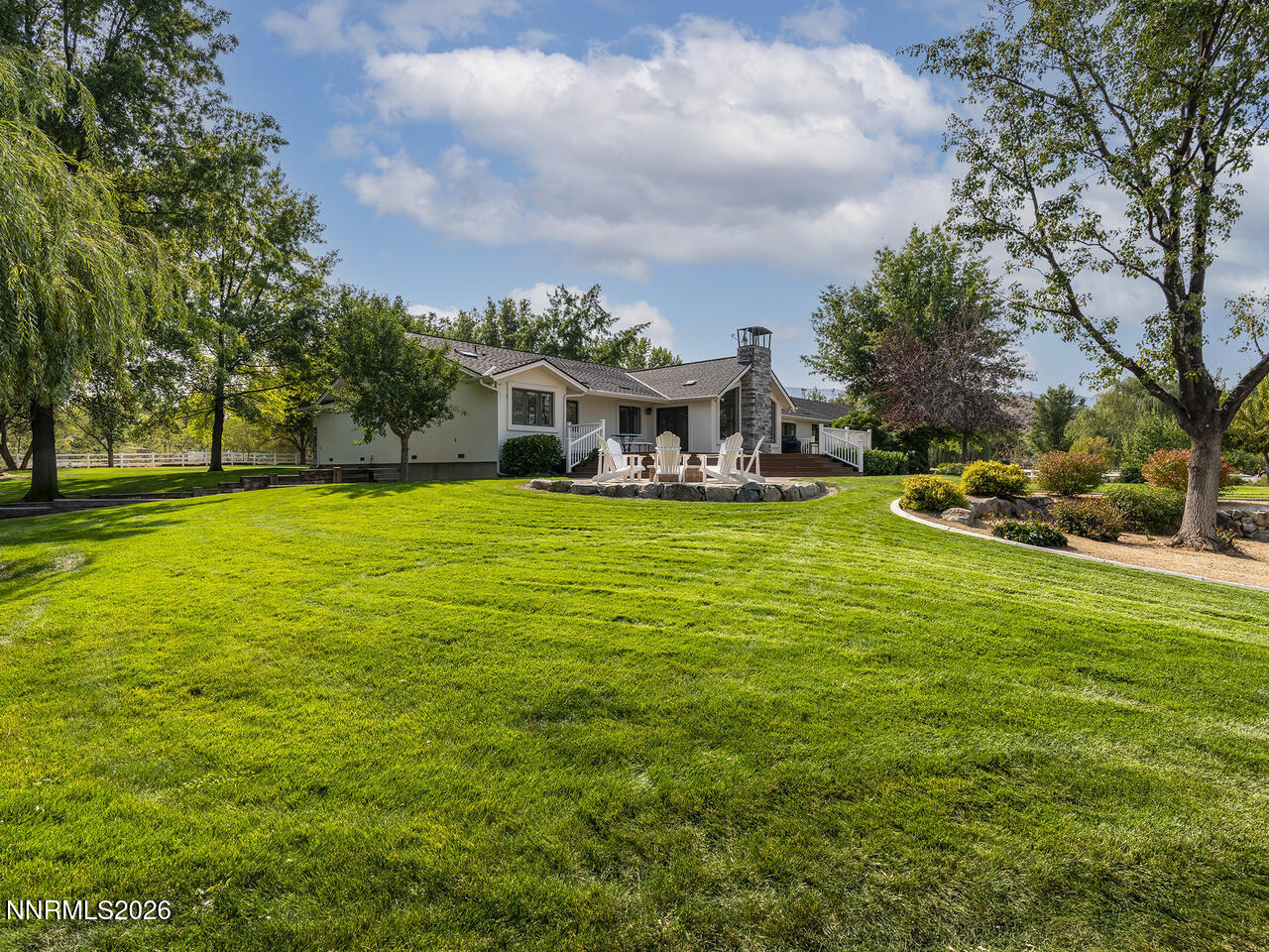 1965 Palmira Drive Reno, NV 89511 - Photo 48 of 63 a view of a house with a big yard and large trees