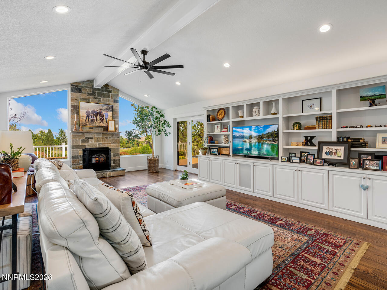 1965 Palmira Drive Reno, NV 89511 - Photo 9 of 63 a living room with fireplace furniture and a open kitchen view