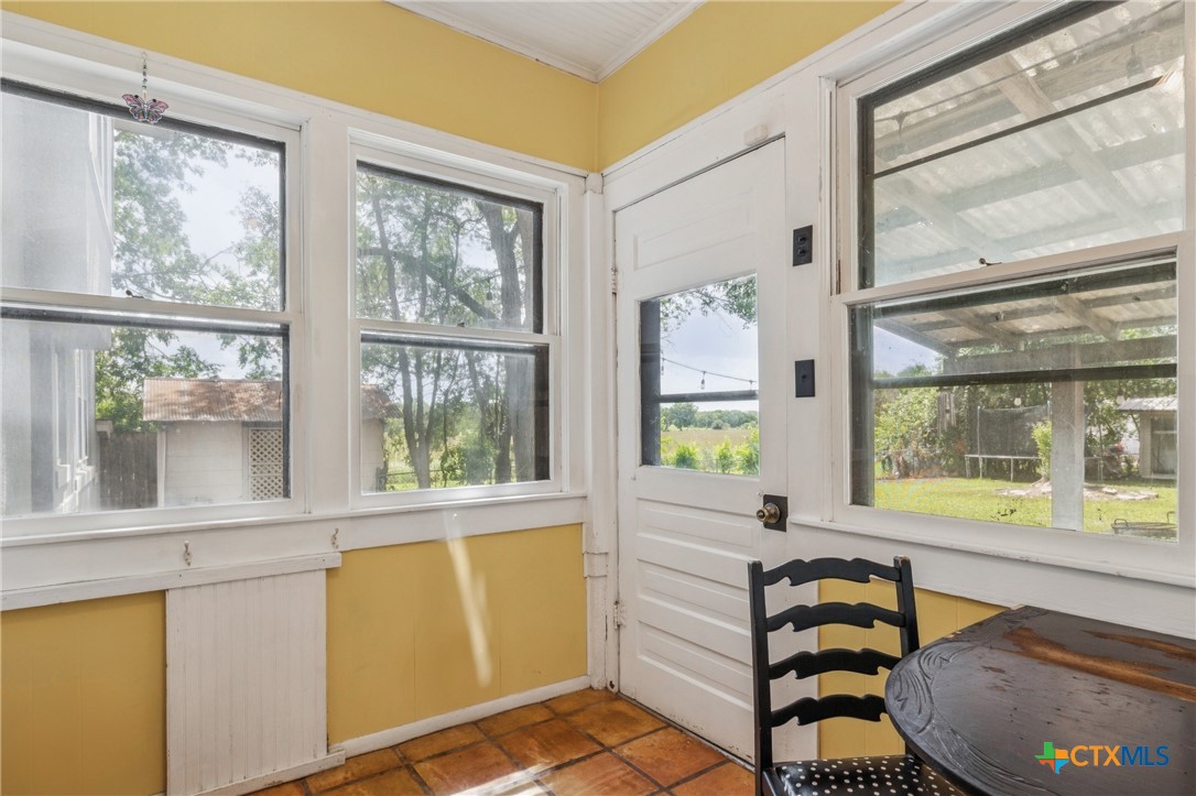 1004 Mitchell Street Gonzales, TX 78629 - Photo 19 of 46 a view of a bedroom with furniture and a window