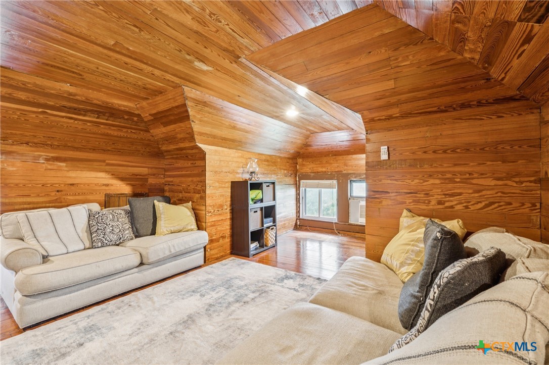 1004 Mitchell Street Gonzales, TX 78629 - Photo 37 of 46 a living room with furniture and a fireplace