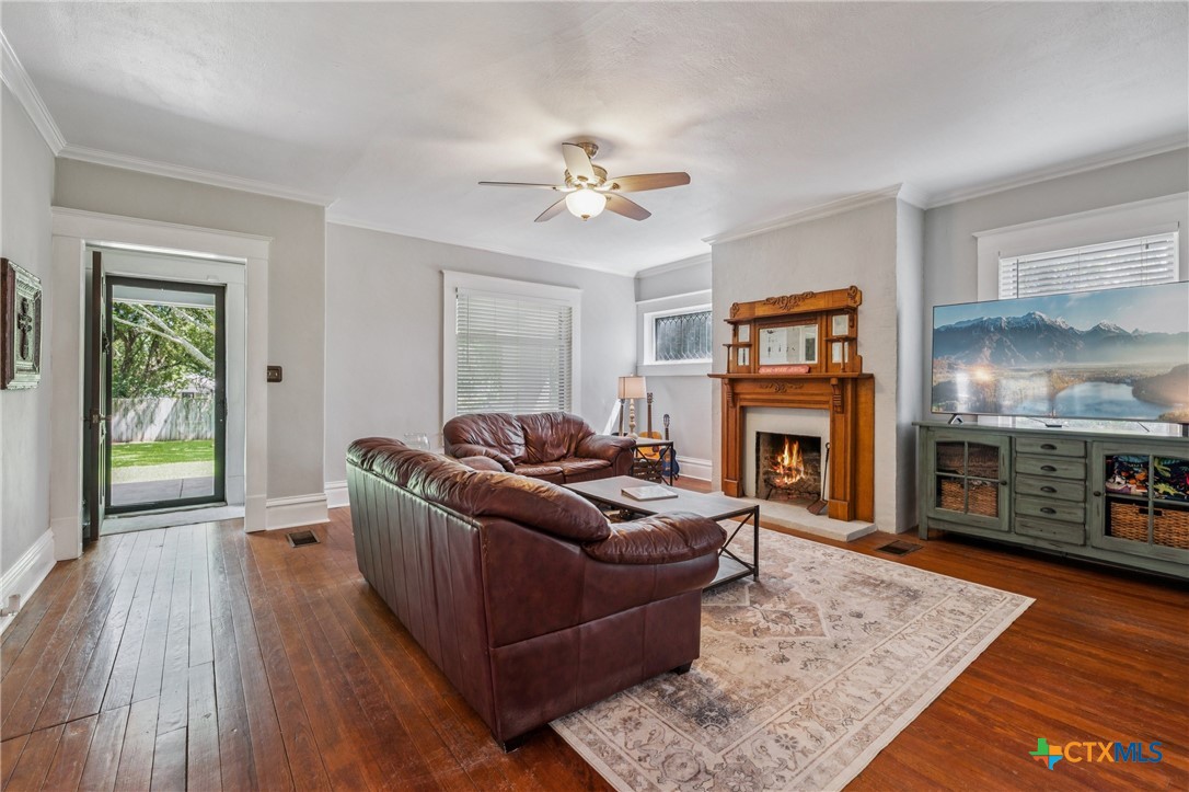1004 Mitchell Street Gonzales, TX 78629 - Photo 5 of 46 a living room with furniture and a fireplace