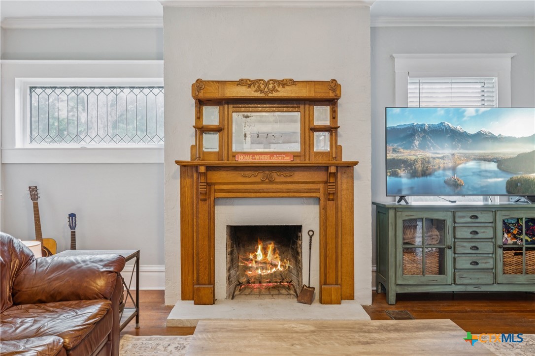 1004 Mitchell Street Gonzales, TX 78629 - Photo 7 of 46 a living room with furniture and a fireplace