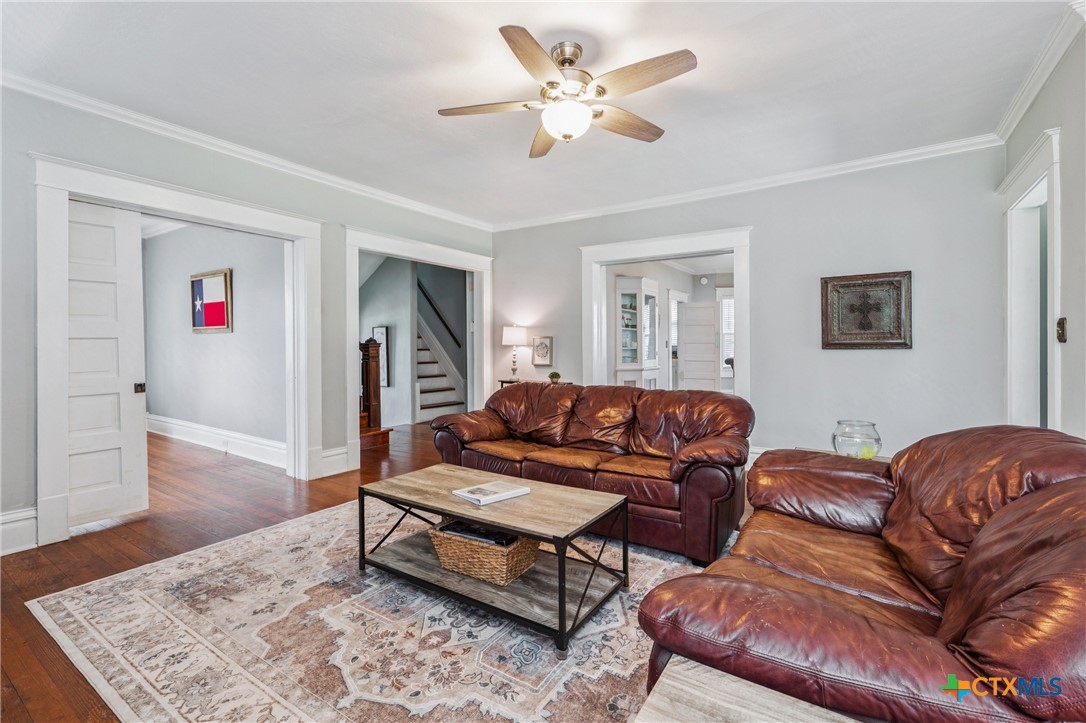 1004 Mitchell Street Gonzales, TX 78629 - Photo 8 of 46 a living room with furniture ceiling fan and a rug