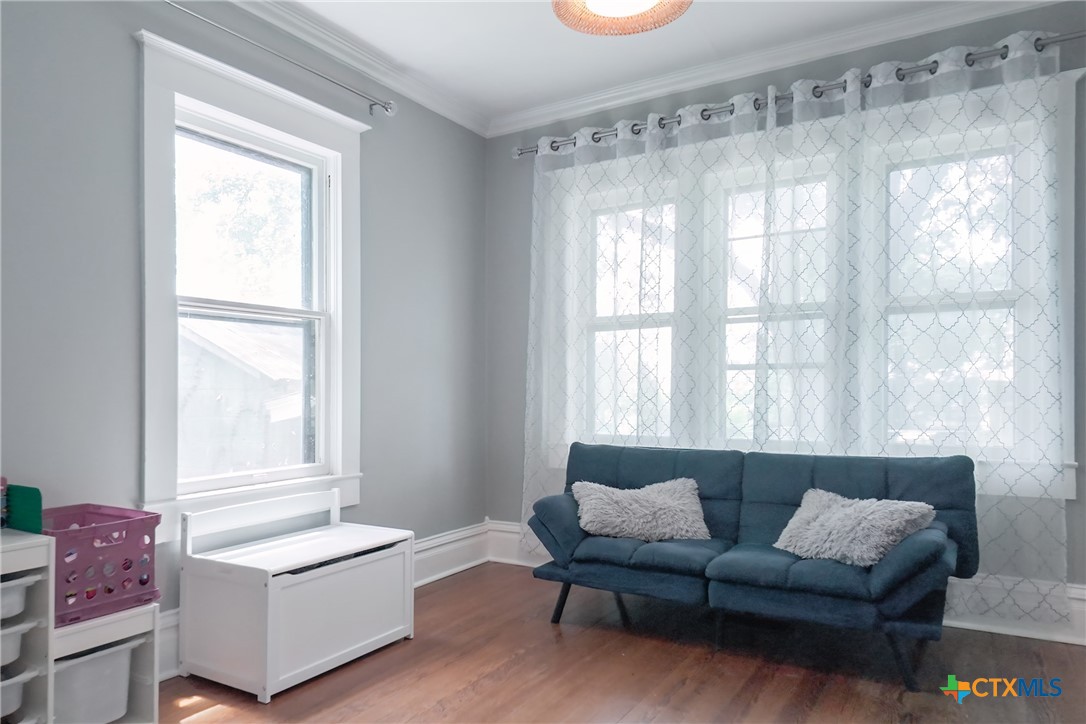 1004 Mitchell Street Gonzales, TX 78629 - Photo 9 of 46 a living room with furniture and a large window