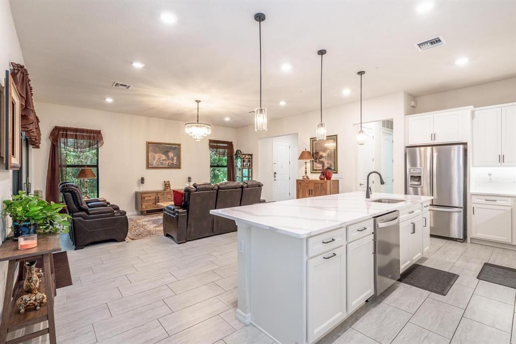 9208 Passiflora Way, Unit 102 Boca Raton, FL 33428 - Photo 17 of 30 a kitchen with a sink and refrigerator